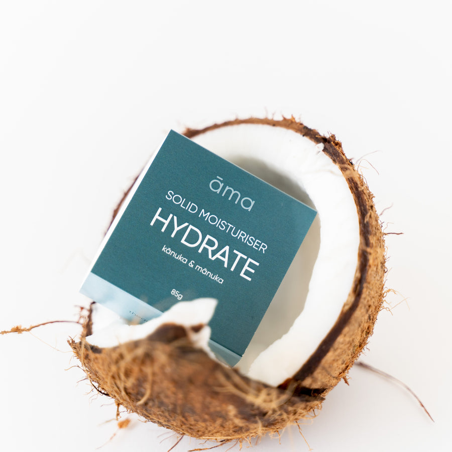 Solid Moisturiser Bar Hydrate - Kanuka and Manuka Essential oils, pictured in a coconut